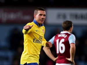 Podolski returned from injury to propel Arsenal to victory at West Ham
